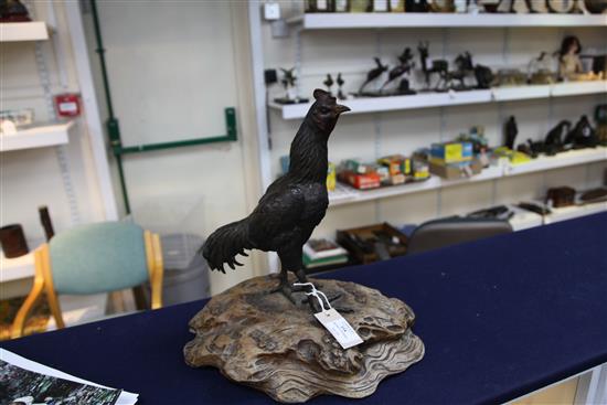A Japanese bronze model of a cockerel, Meiji period, total height 39cm, loss to one tail feather